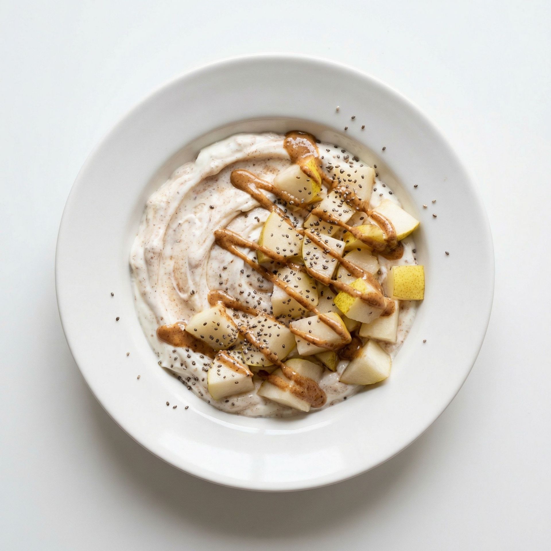 Spiced Pear & Almond Butter Yogurt Bowl, prepared as a finished Lila recipe