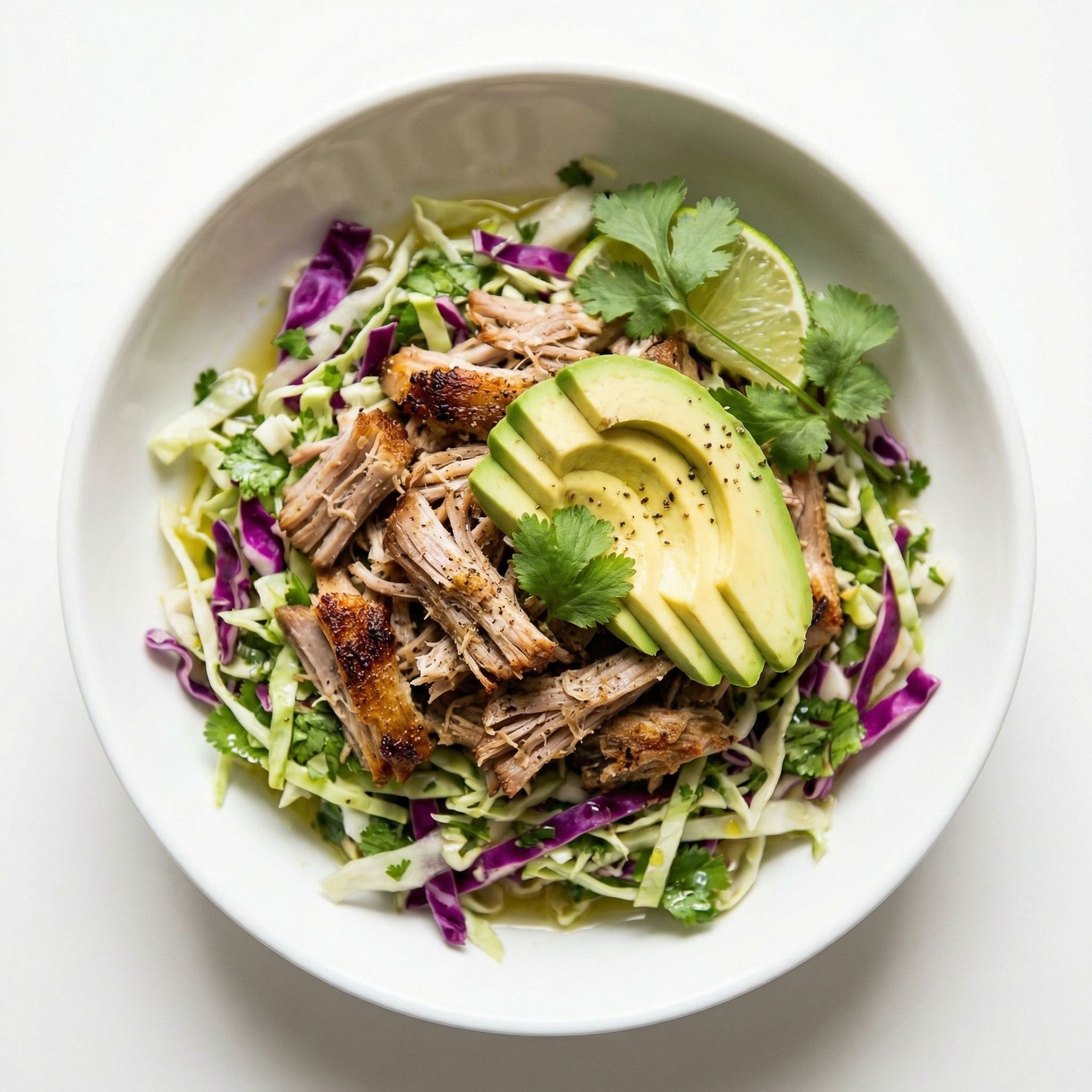 Slow Cooker Pork Carnitas Bowls With Cabbage Slaw, prepared as a finished Lila recipe